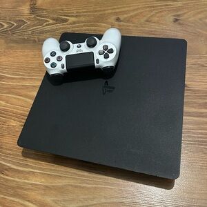 PS4 console with remote and HDMI cable